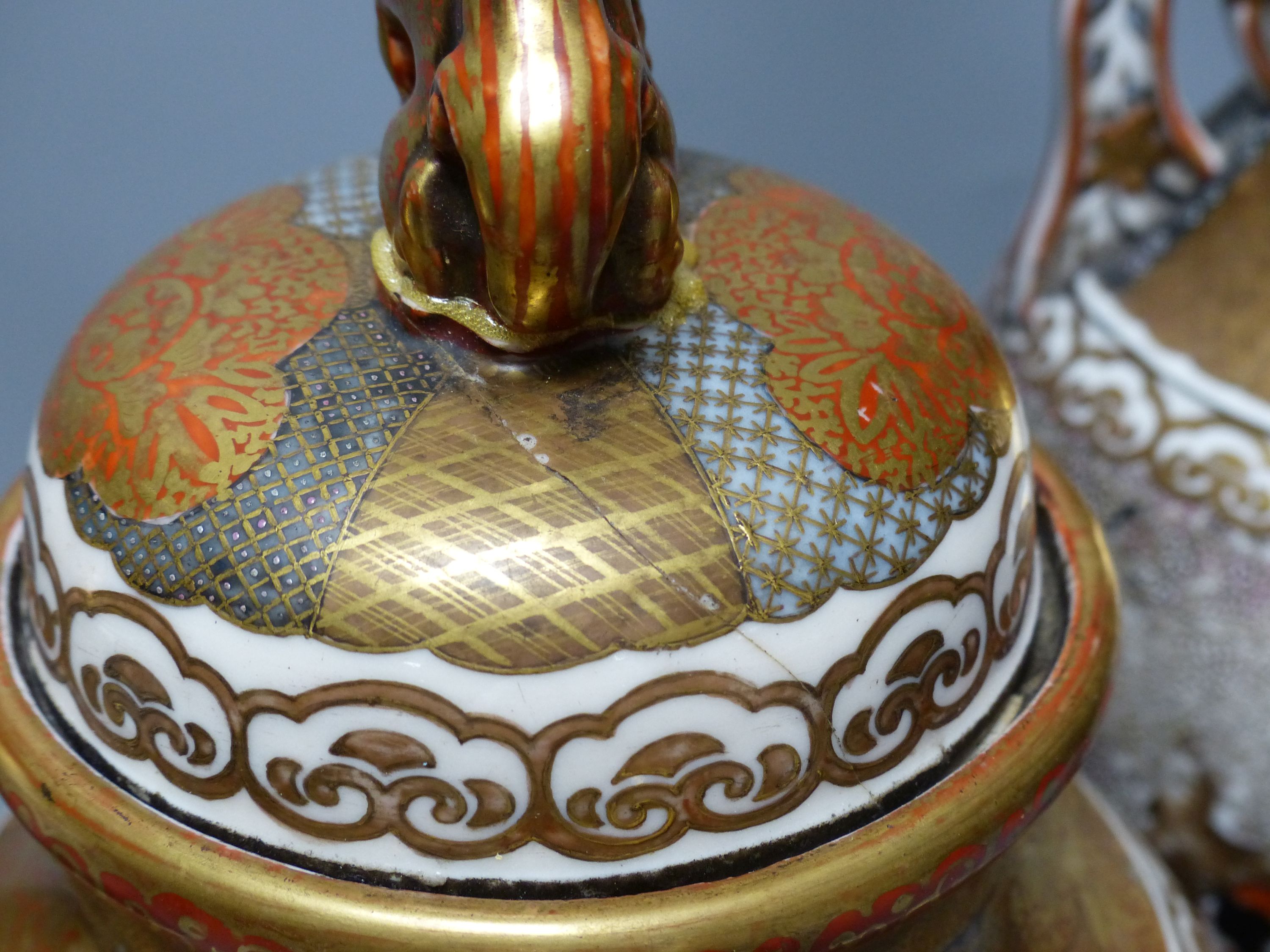 A Japanese Kutani porcelain garniture of two vases and a similar koro and cover, tallest 31cm